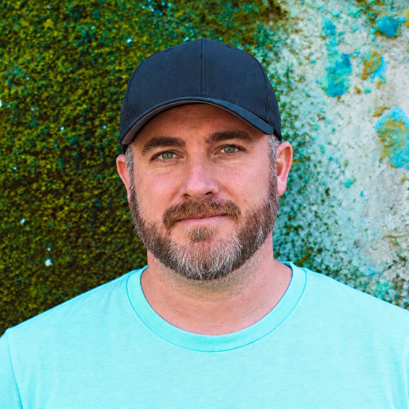 Marcus Burnette wearing a navy cap outdoors.